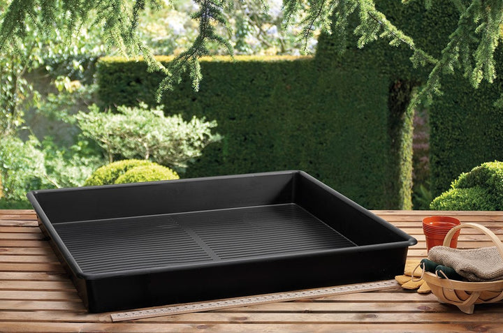 Garland Tray Black 120x60x12 cm
 Black plastic tray on a wooden surface with a garden background